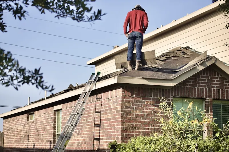 Professional roofer working on a residential roof in St. Petersburg